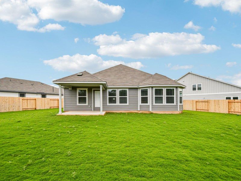 Back of house featuring a patio, a shingled roof, and a fenced backyard Back of house featuring a patio, a shingled roof, and a fenced backyard