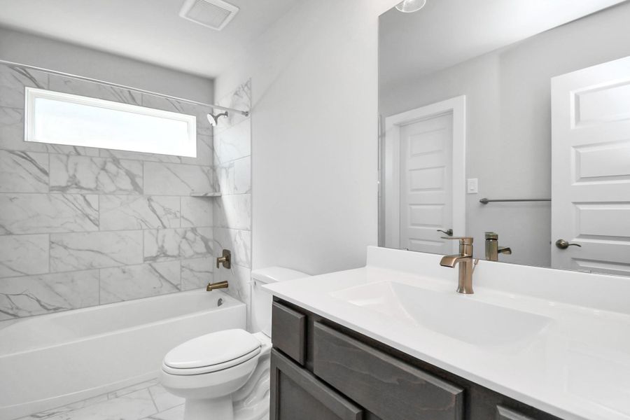 Guest suite bath. Sample photo of completed home with similar floor plan. Actual colors and selections may vary.