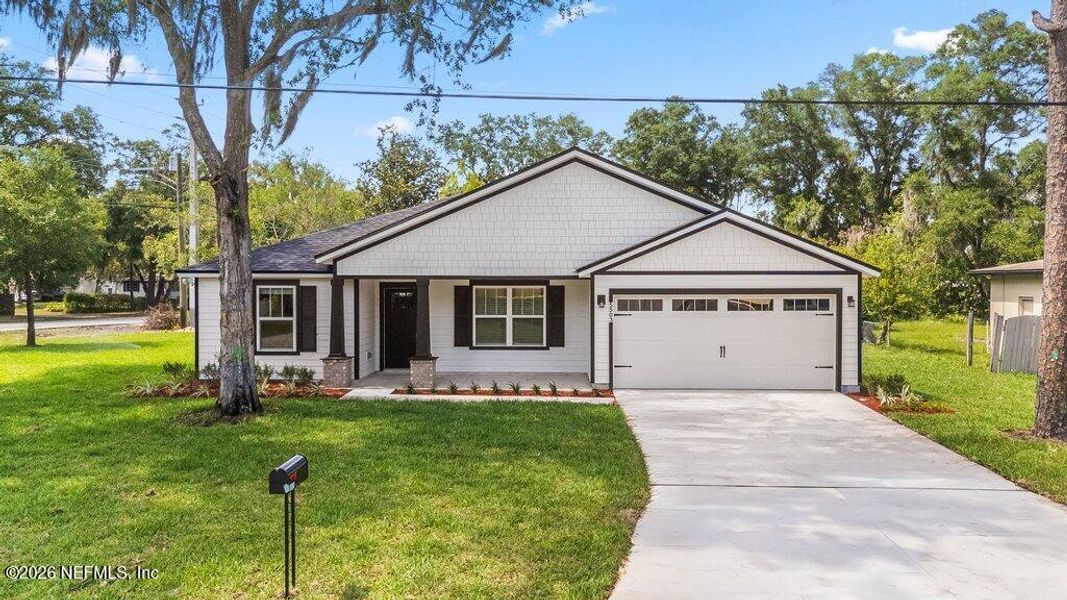 Front exterior of a new home in , Jacksonville, FL, highlighting curb appeal (Image 26).