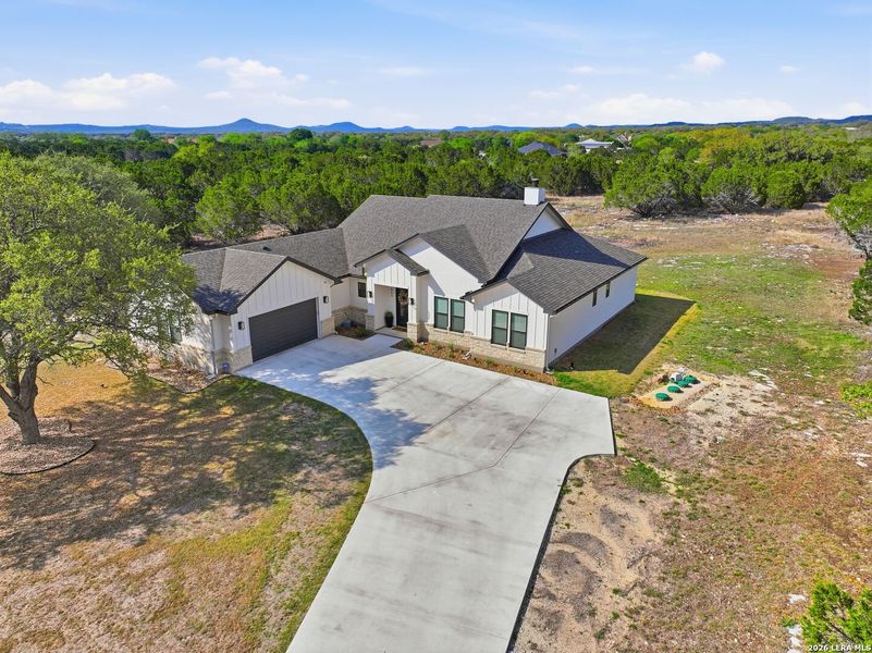Front exterior of a new home in , Bandera, TX, highlighting curb appeal (Image 29).