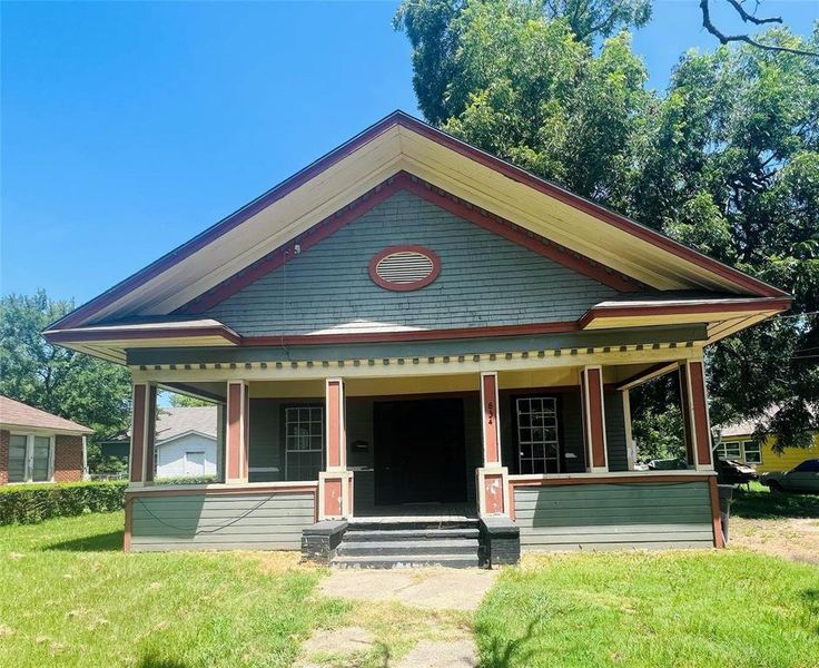 View of front of house with a porch and a front lawn View of front of house with a porch and a front lawn