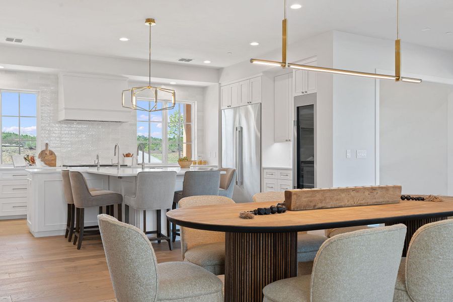 Dining area with recessed lighting, light wood-style flooring, and visible vents Dining area with recessed lighting, light wood-style flooring, and visible vents