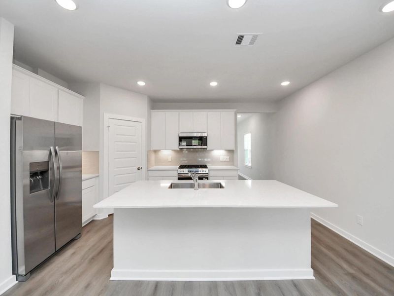 Furnished interior view inside a new home in Caney Creek Place, Conroe (Image 8).