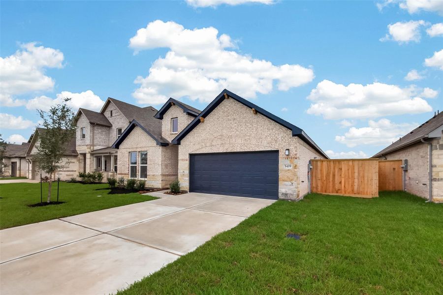 Front exterior of a new home in Foxtail Palms, Manvel, TX, highlighting curb appeal (Image 1). Front exterior of a new home in Foxtail Palms, Manvel, TX, highlighting curb appeal (Image 1).