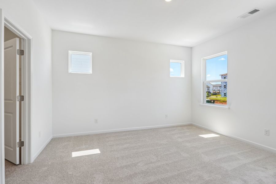 Spacious, unfurnished interior of a new home in Terraces at the Exchange, Indian Land (Image 23).