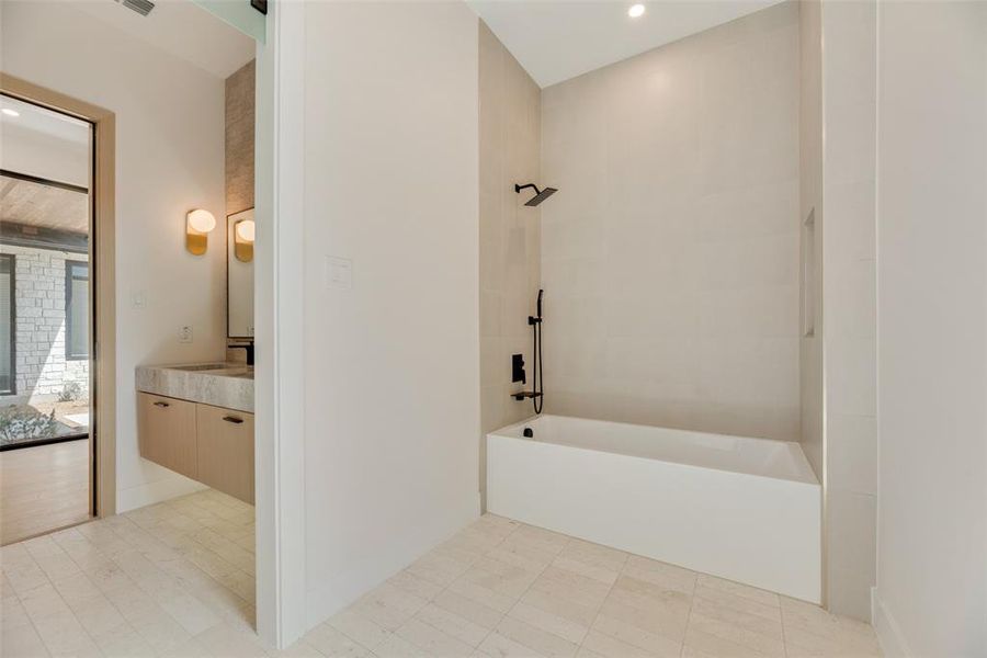 Bathroom with tile patterned floors and vanity