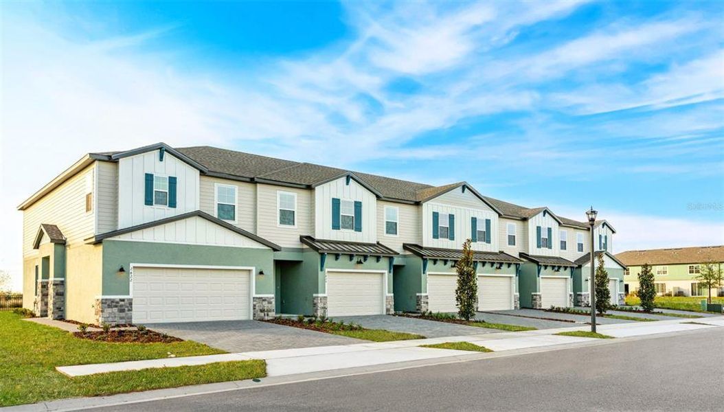 Front exterior of a new home in Magnolia Reserve, Ocoee, FL, highlighting curb appeal (Image 2). Front exterior of a new home in Magnolia Reserve, Ocoee, FL, highlighting curb appeal (Image 2).