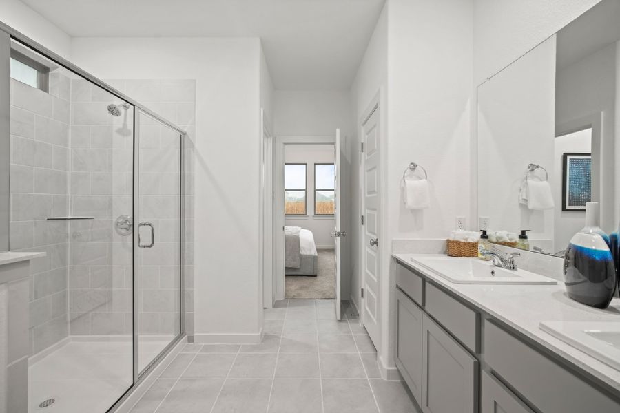 Primary Bathroom in a Trinity Ranch Oak Model home in Elgin TX by Trophy Signature Homes