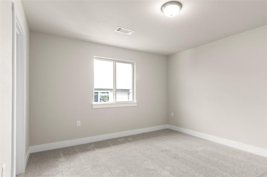 Empty room with light colored carpet and baseboards Empty room with light colored carpet and baseboards