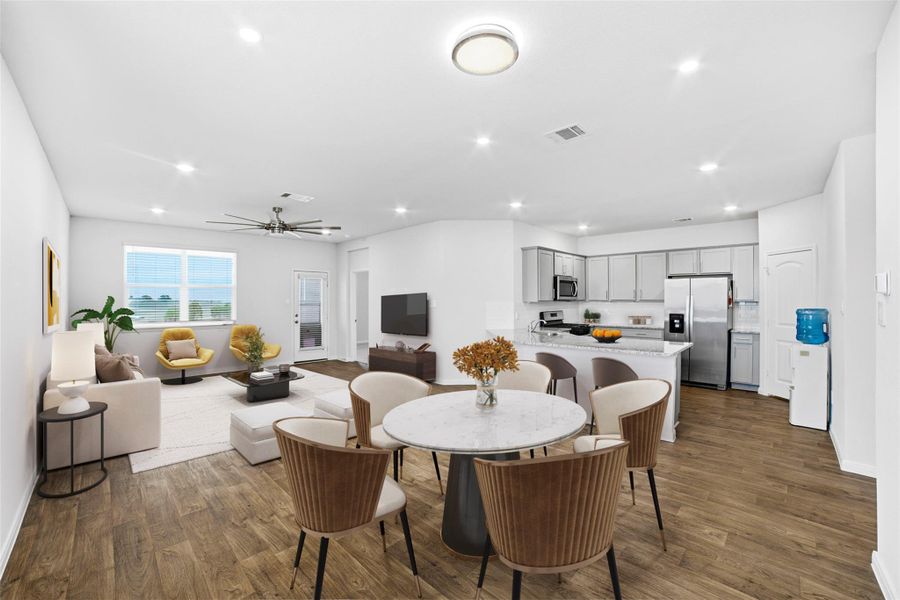 Dining room with a ceiling fan, recessed lighting, and dark wood finished floors Dining room with a ceiling fan, recessed lighting, and dark wood finished floors