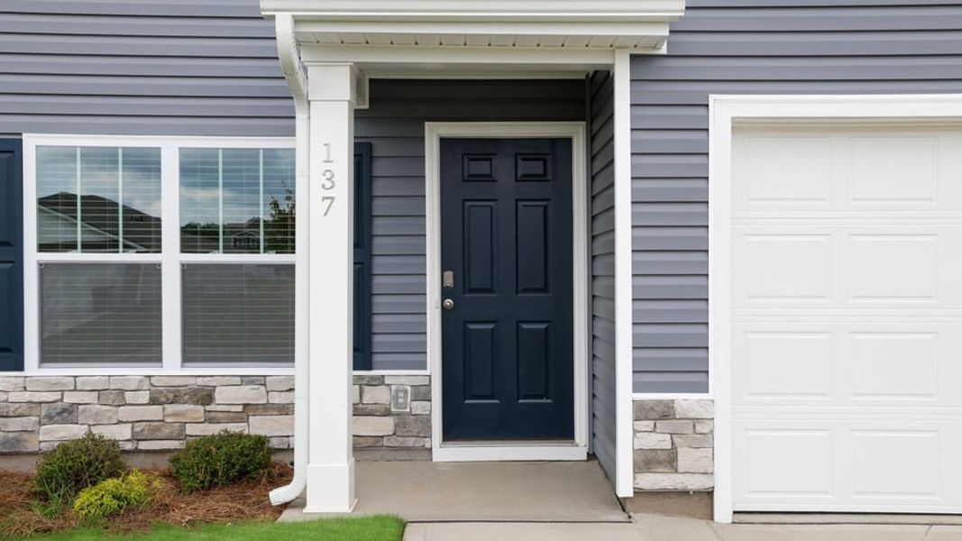 Exterior details and patio area of a home in Bentley Park, Greenwood (Image 2). Exterior details and patio area of a home in Bentley Park, Greenwood (Image 2).