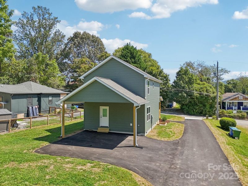 Back yard with carport and additional parking space