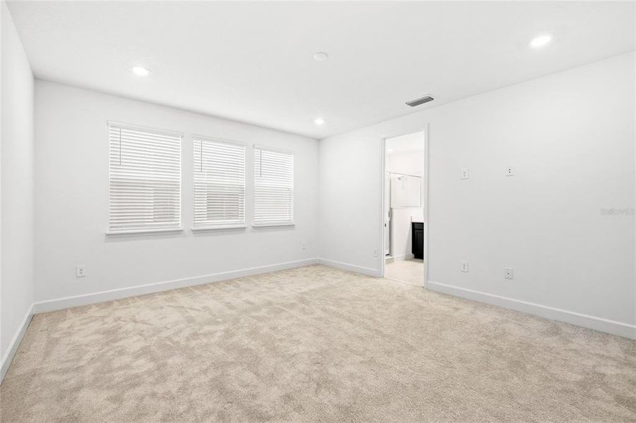 Spacious, unfurnished interior of a new home in Harvest At Ovation 50s, Winter Garden (Image 30).