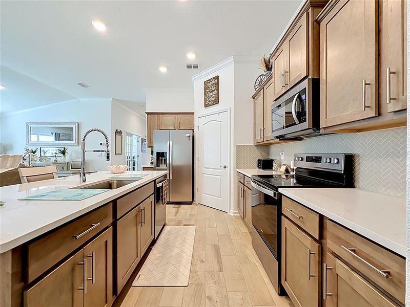 Furnished interior view inside a new home in Sawmill Branch Express, Palm Coast (Image 7).