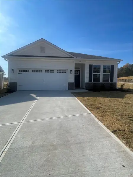 Front exterior of a new home in Springwood Grove, Central, SC, highlighting curb appeal (Image 2). Front exterior of a new home in Springwood Grove, Central, SC, highlighting curb appeal (Image 2).