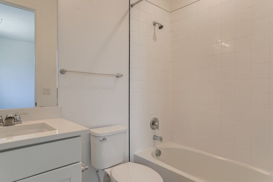 Upstairs bathroom in Cornell II plan at The Outlook at Southshore by Century Communities