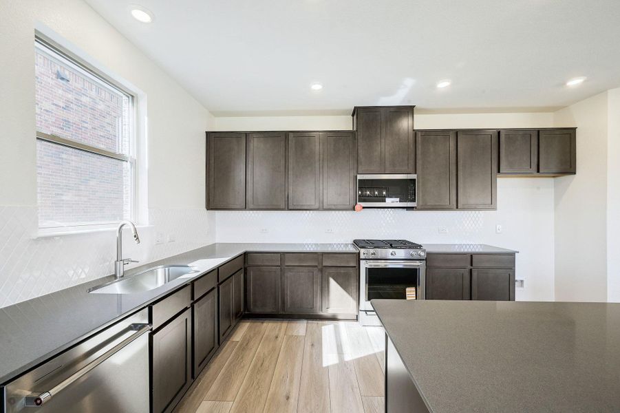 Furnished interior view inside a new home in Salerno - Classic Collection, Round Rock (Image 11). Furnished interior view inside a new home in Salerno - Classic Collection, Round Rock (Image 11).