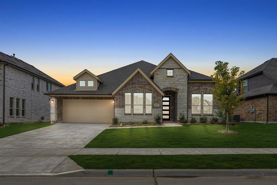 Front exterior of a new home in West Crossing, Anna, TX, highlighting curb appeal (Image 2). Front exterior of a new home in West Crossing, Anna, TX, highlighting curb appeal (Image 2).