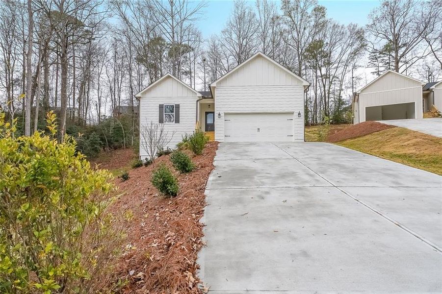 Front exterior of a new home in , Gainesville, GA, highlighting curb appeal (Image 17).