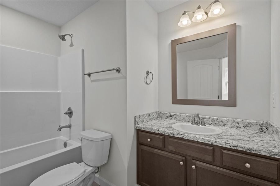 Representative furnished interior of a home built from the Roebuck by Enchanted Homes in Las Palomas Country Club Estates, La Vernia (Image 12).