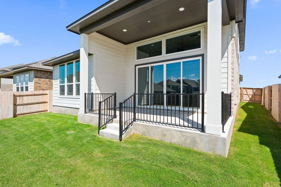 Exterior details and patio area of a home in Lariat, Liberty Hill (Image 29).
