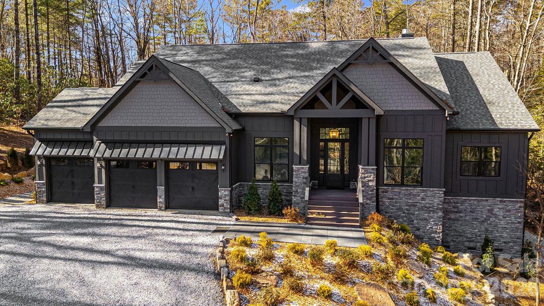 Front exterior of a new home in , Sapphire, NC, highlighting curb appeal (Image 25).