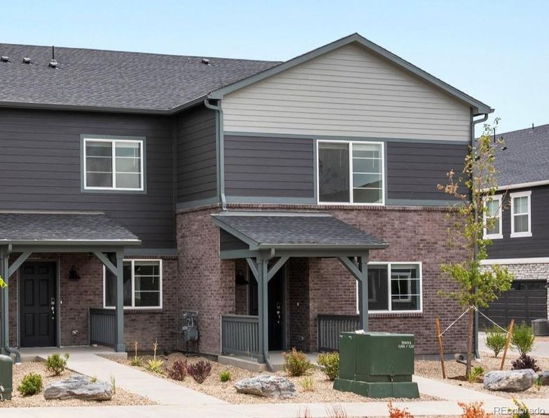 Front exterior of a new home in , Aurora, CO, highlighting curb appeal (Image 1). Front exterior of a new home in , Aurora, CO, highlighting curb appeal (Image 1).