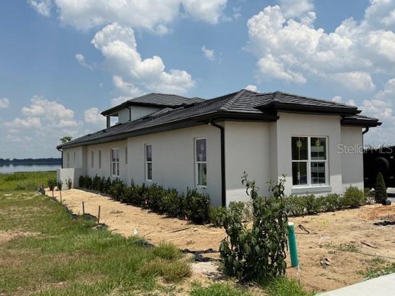 Front exterior of a new home in , Lake Alfred, FL, highlighting curb appeal (Image 21).