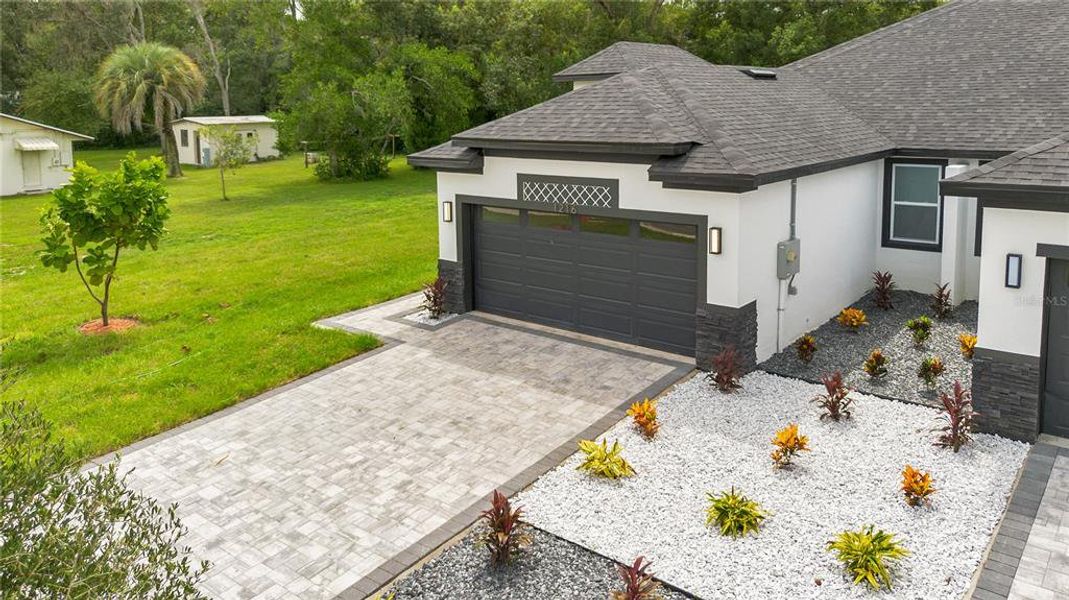 Front exterior of a new home in , Apopka, FL, highlighting curb appeal (Image 27).