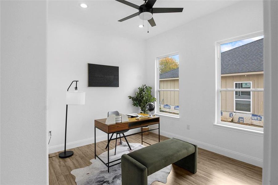 Home office featuring light wood finished floors, recessed lighting, and a ceiling fan Home office featuring light wood finished floors, recessed lighting, and a ceiling fan