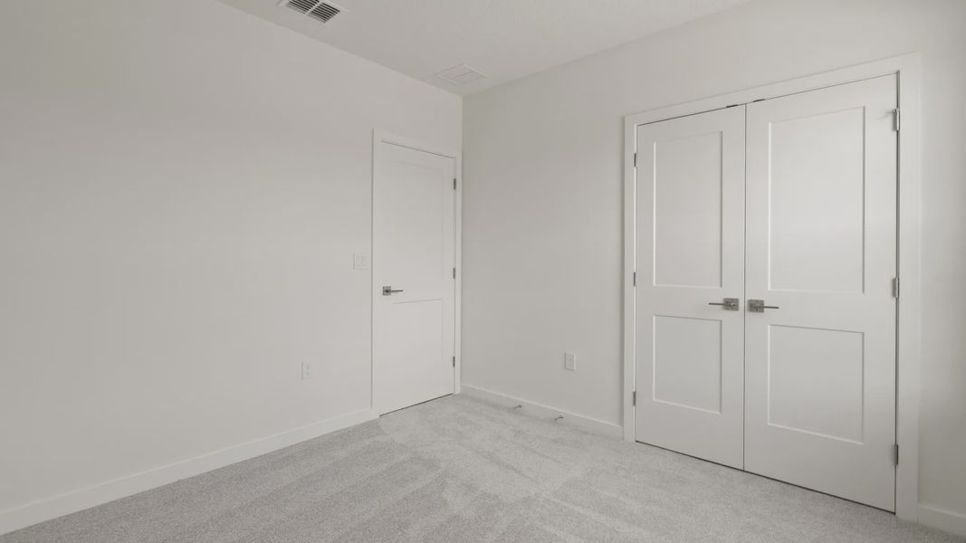 Furnished interior view inside a new home in Grasslands West, Lakeland (Image 28).