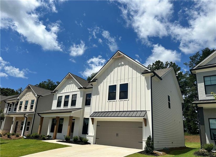 Front exterior of a new home in Summerlin, Winder, GA, highlighting curb appeal (Image 26).