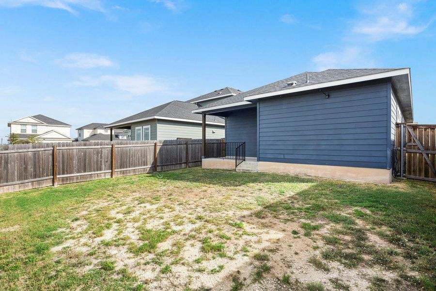 View of fenced backyard