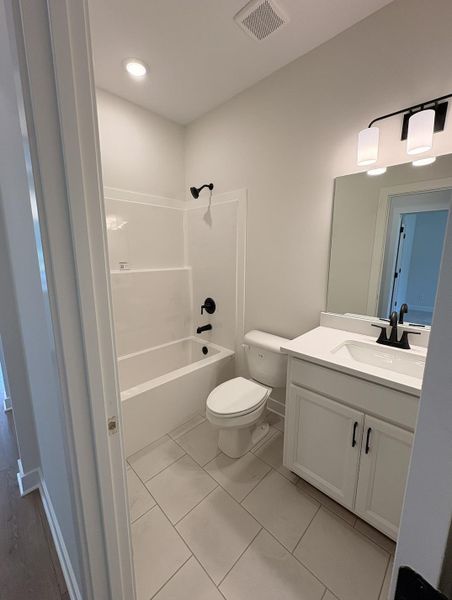 Furnished interior view inside a new home in Villages of Green Meadows, Munford (Image 10).