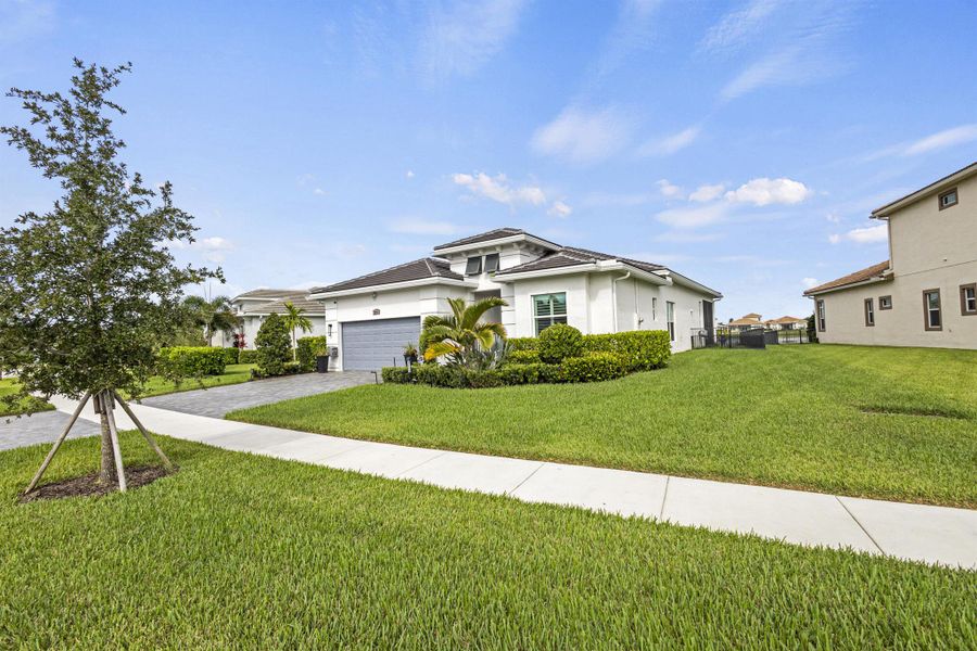 Front exterior of a new home in , Port St. Lucie, FL, highlighting curb appeal (Image 20).