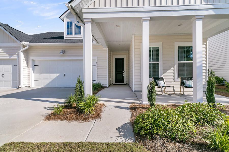 Front exterior of a new home in Horizons at Summers Corner | 55+: The Legends, Summerville, SC, highlighting curb appeal (Image 25).