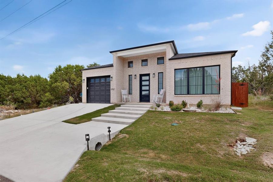 Front exterior of a new home in , Granbury, TX, highlighting curb appeal (Image 21).