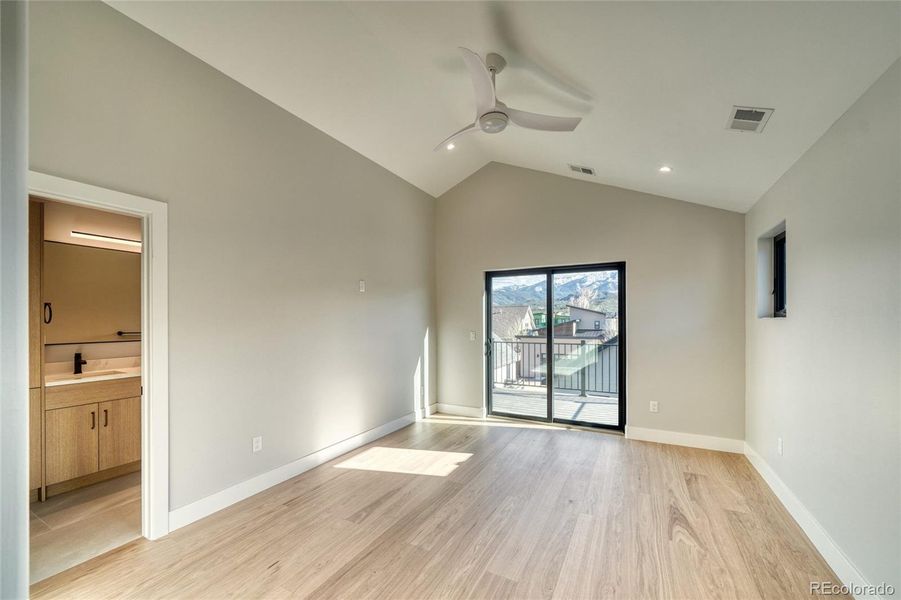 Primary Suite with Vaulted Ceilings & Private Balcony