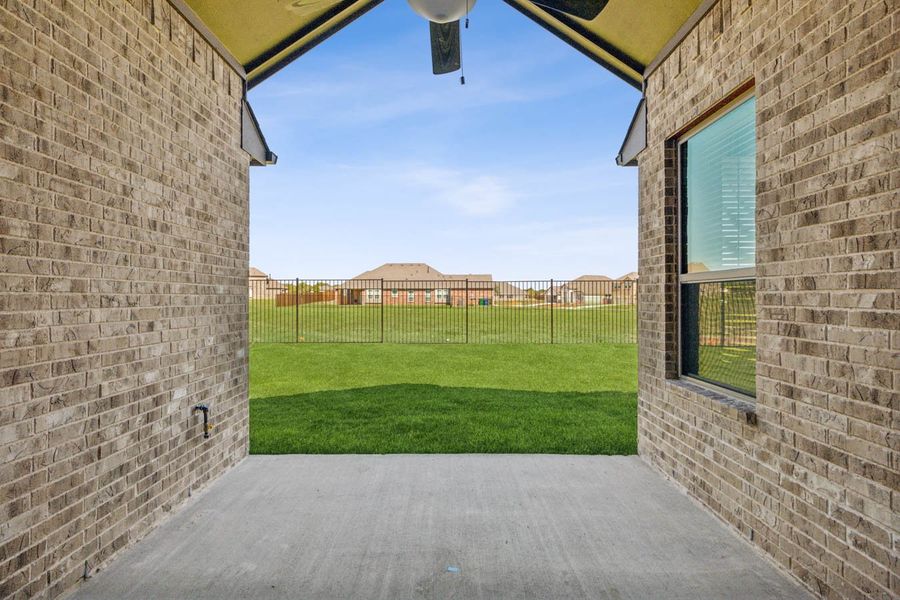 Exterior details and patio area of a home in Oaks of North Grove, Waxahachie (Image 3).