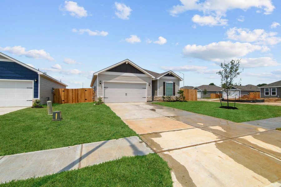 Front exterior of a new home in Trails at Cochran Ranch, Waller, TX, highlighting curb appeal (Image 2). Front exterior of a new home in Trails at Cochran Ranch, Waller, TX, highlighting curb appeal (Image 2).
