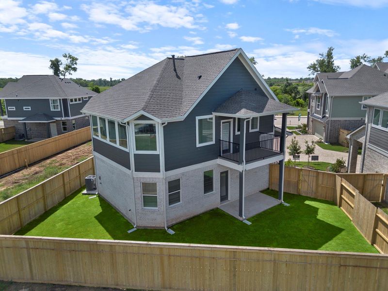 Front exterior of a new home in Sienna, Missouri City, TX, highlighting curb appeal (Image 14). Front exterior of a new home in Sienna, Missouri City, TX, highlighting curb appeal (Image 14).