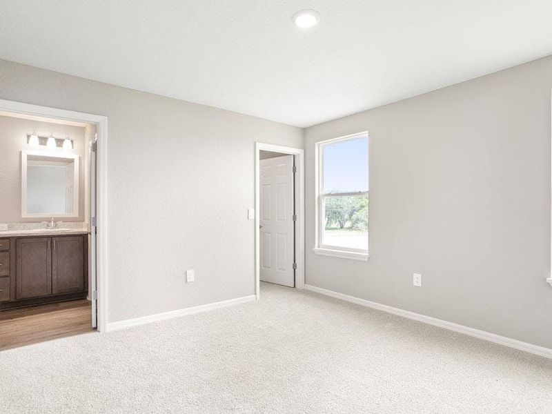 Upstairs, rest and relaxation await in your private owner`s suite - Bimini townhome by Highland Homes