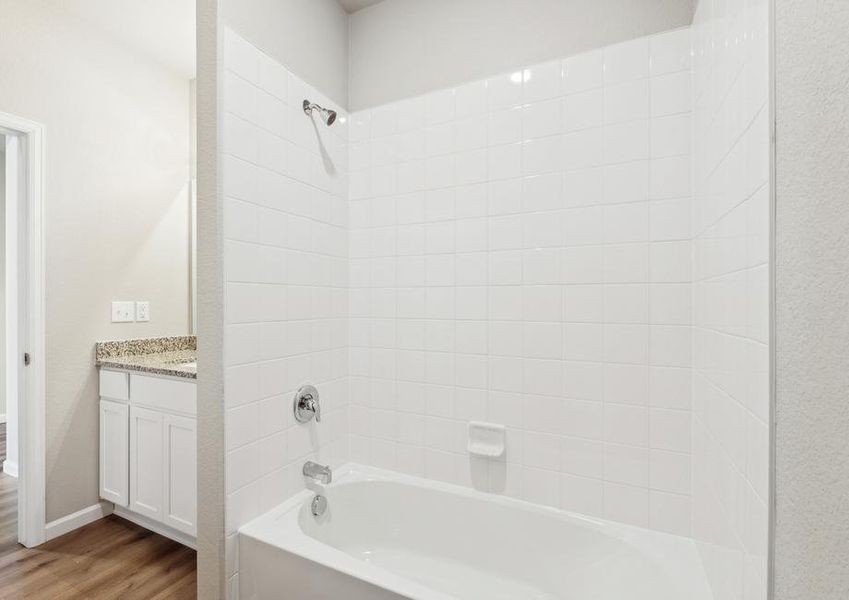 The secondary bathroom has a shower-tub combination.