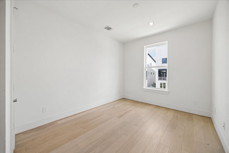 Two secondary bedrooms have wood floors and walk-in closets. Two secondary bedrooms have wood floors and walk-in closets.