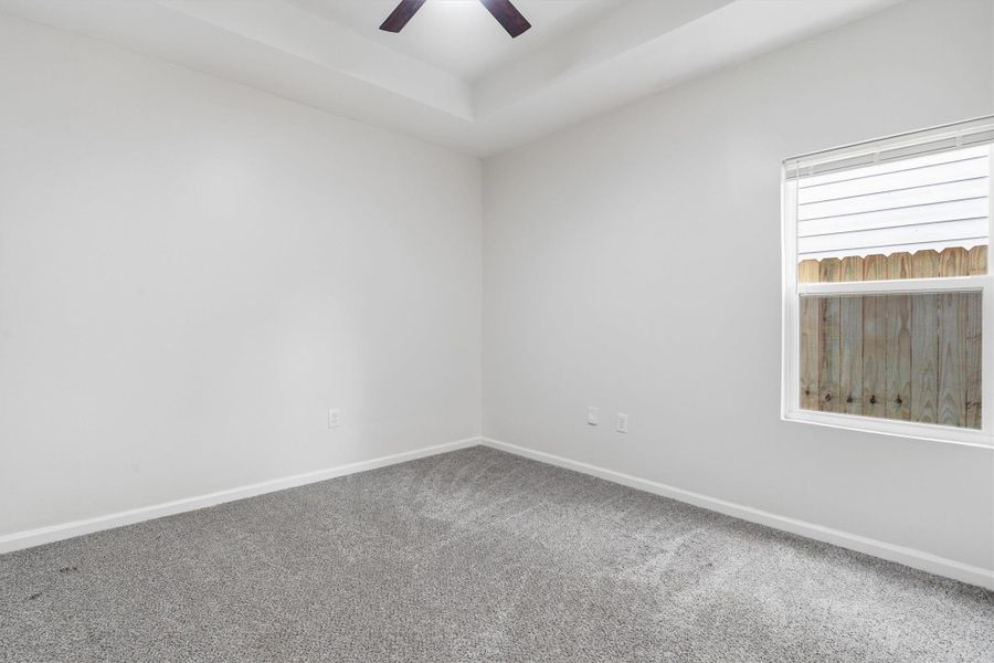 Third bedroom, fresh carpet and modern ceiling fan