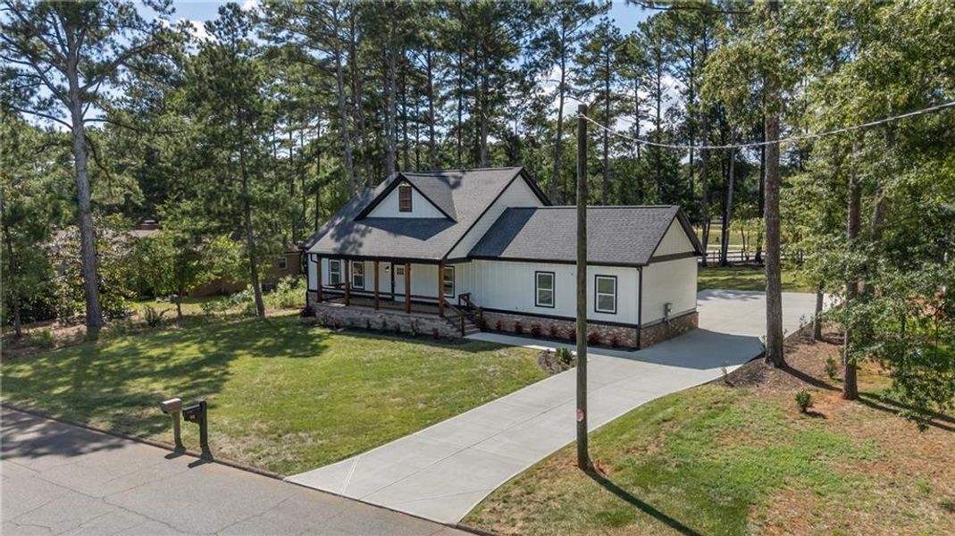 Front exterior of a new home in , Monroe, GA, highlighting curb appeal (Image 30). Front exterior of a new home in , Monroe, GA, highlighting curb appeal (Image 30).