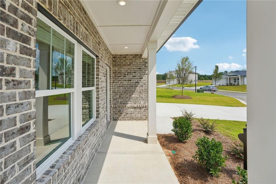 Exterior details and patio area of a home in Northwoods at Mirror Lake, Villa Rica (Image 26).