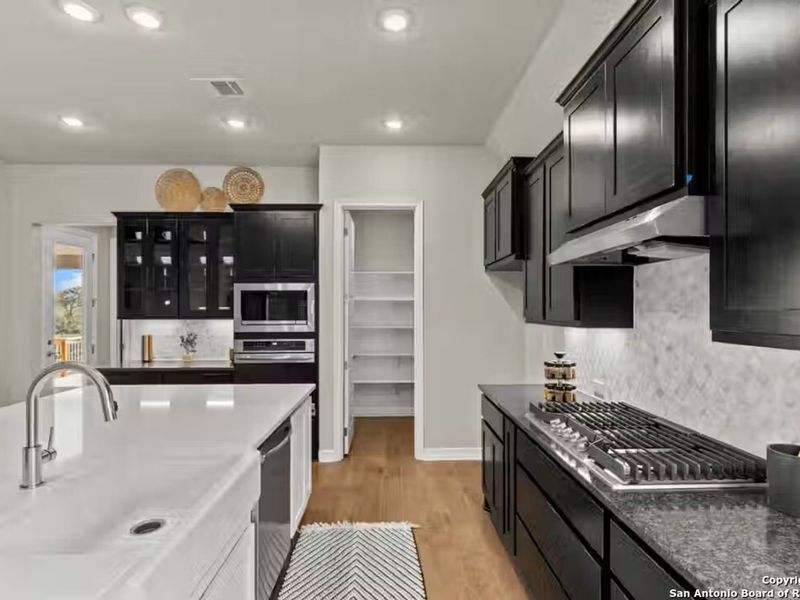 Furnished interior view inside a new home in Potranco Oaks, Castroville (Image 18).