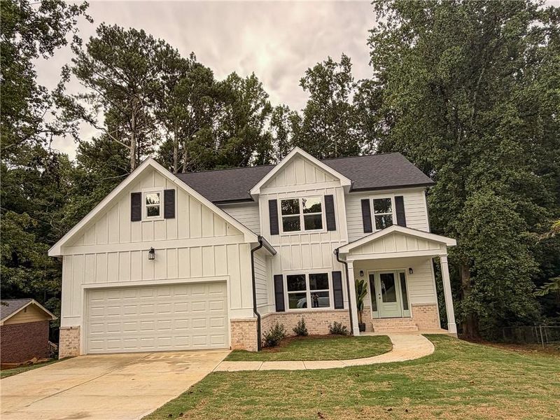 Front exterior of a new home in , Norcross, GA, highlighting curb appeal (Image 1). Front exterior of a new home in , Norcross, GA, highlighting curb appeal (Image 1).