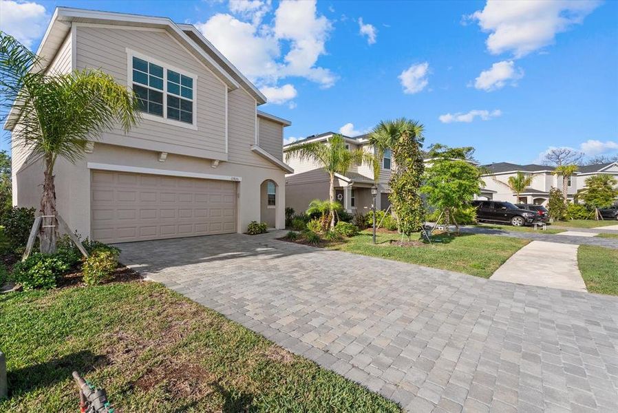 Front exterior of a new home in , Bradenton, FL, highlighting curb appeal (Image 16).